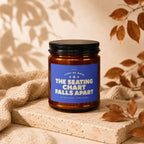 Amber jar candle with blue label reading "Light Me When The Seating Chart Falls Apart."