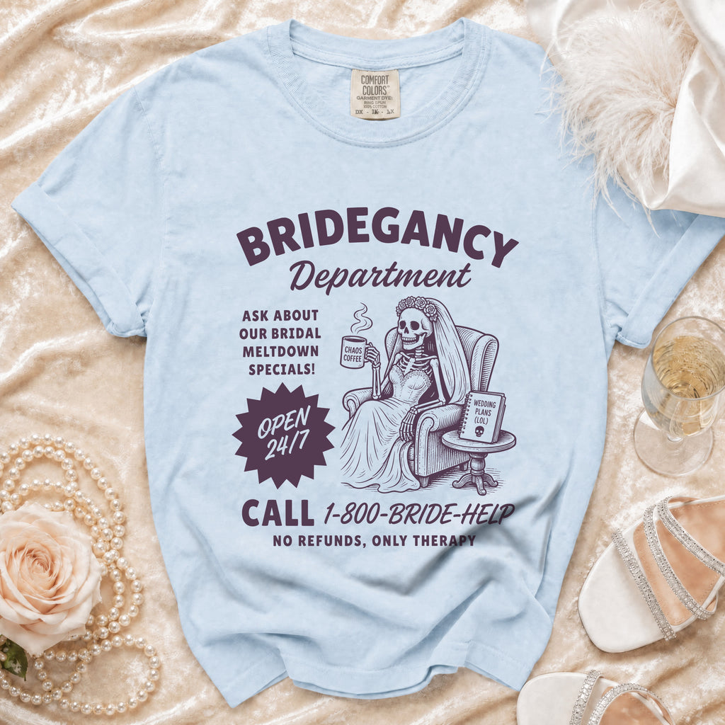 Light blue t-shirt with "Bridegancy Department" graphic of a skeleton bride.