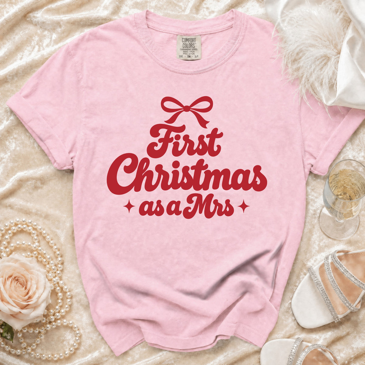 Pink t-shirt with red text "First Christmas as a Mrs" and a bow.