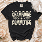 Black t-shirt with "CHAMPAGNE COMMITTEE" text and champagne glasses graphic.