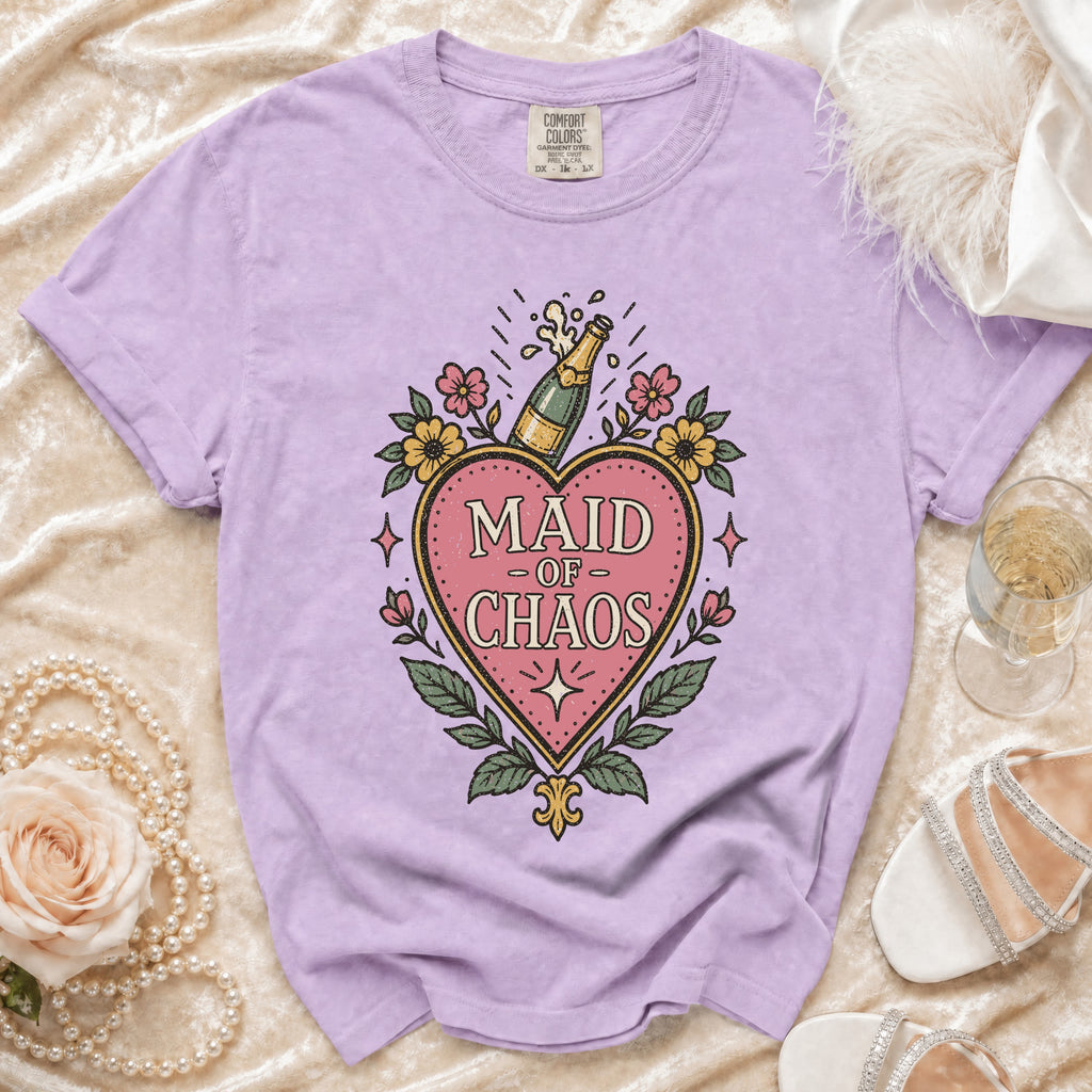 Light purple t-shirt with "Maid of Chaos" text and champagne bottle graphic.