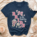 Navy t-shirt with "BRIDE In My Bride Era" graphic and wedding accents.