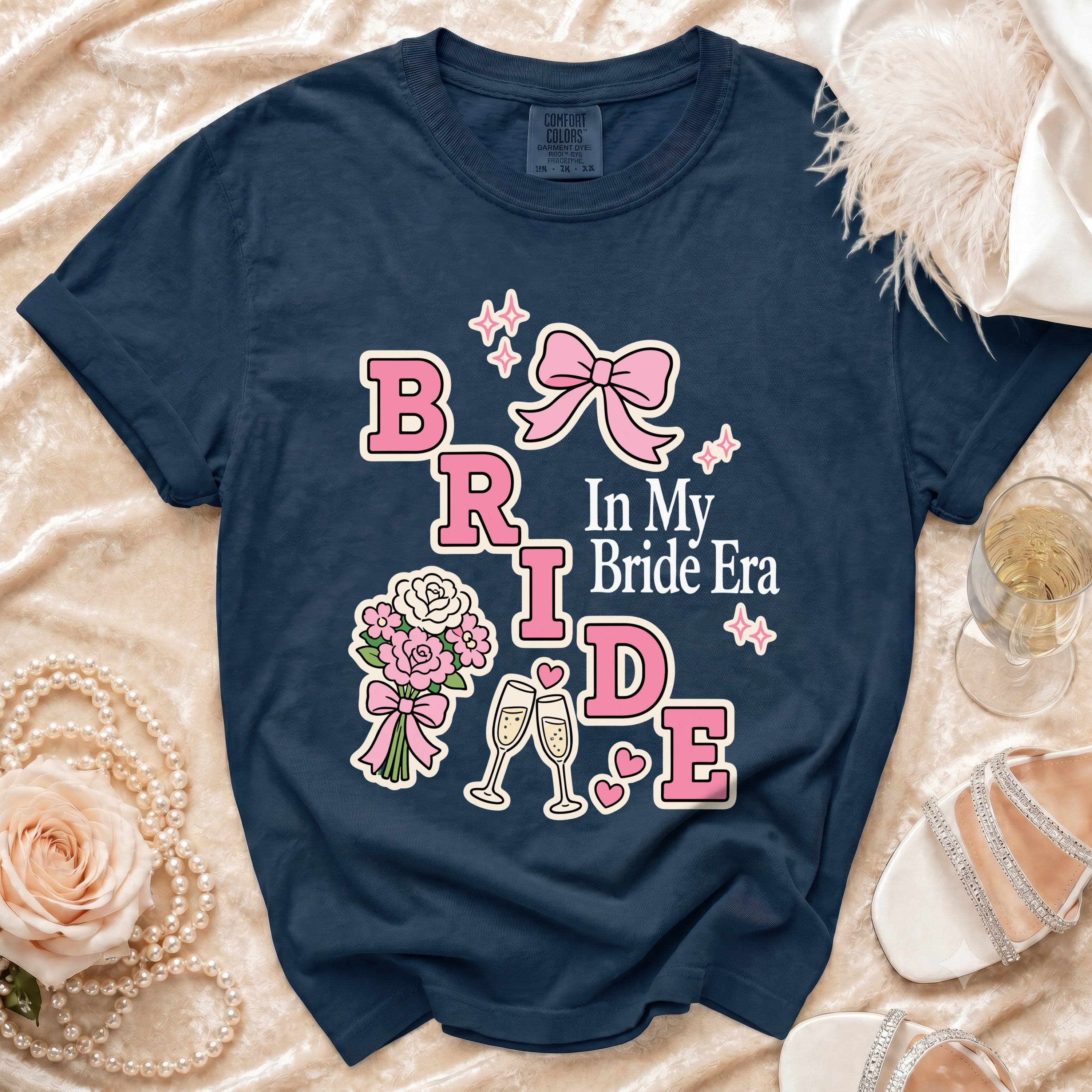 Navy t-shirt with "BRIDE In My Bride Era" graphic and wedding accents.