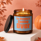 Amber glass candle with label reading "The Wedding Is Coming Over FINALLY VOWED".