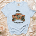 Light blue t-shirt with "The Honeymoon" graphic featuring tarot cards for past, present, future.