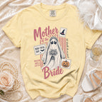 Yellow t-shirt with a ghost bride graphic, "Mother of the Bride" text, and Halloween stamps.