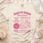 Maid of Honor Department cream t-shirt with pink text and graphic.
