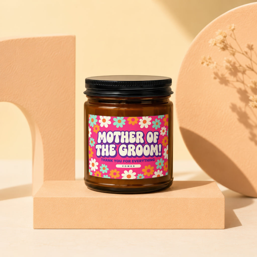Brown candle with "Mother of the Groom!" and floral label on a pedestal.