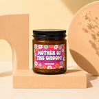 Brown candle with "Mother of the Groom!" and floral label on a pedestal.