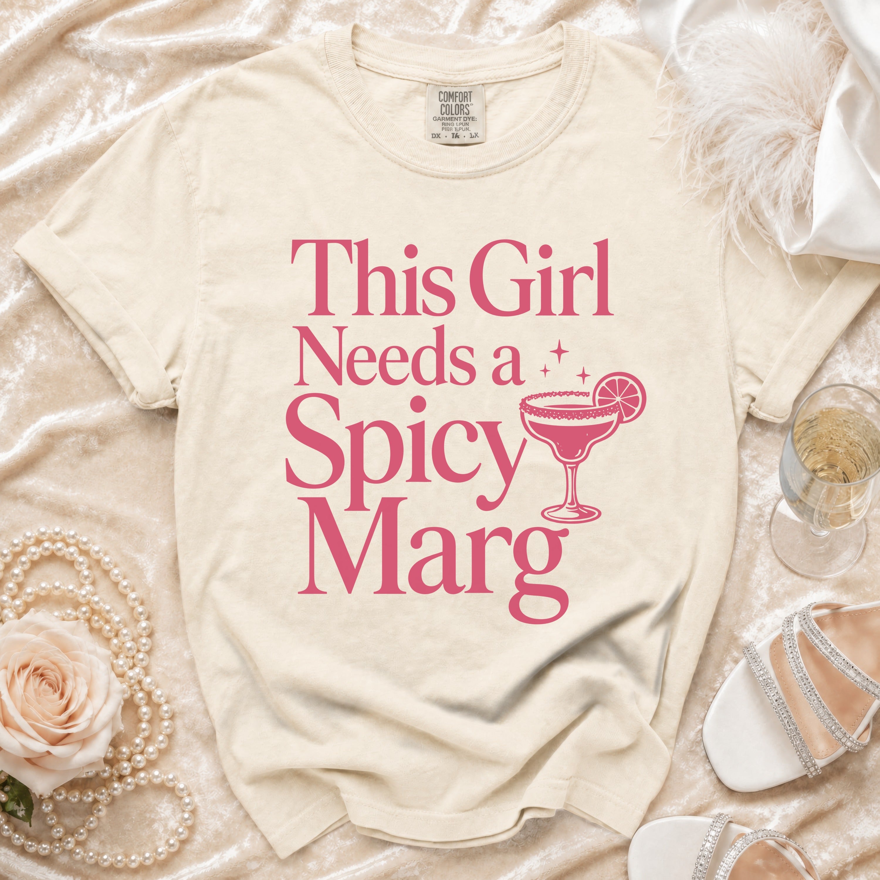 T-shirt with "This Girl Needs a Spicy Marg" text and margarita graphic.