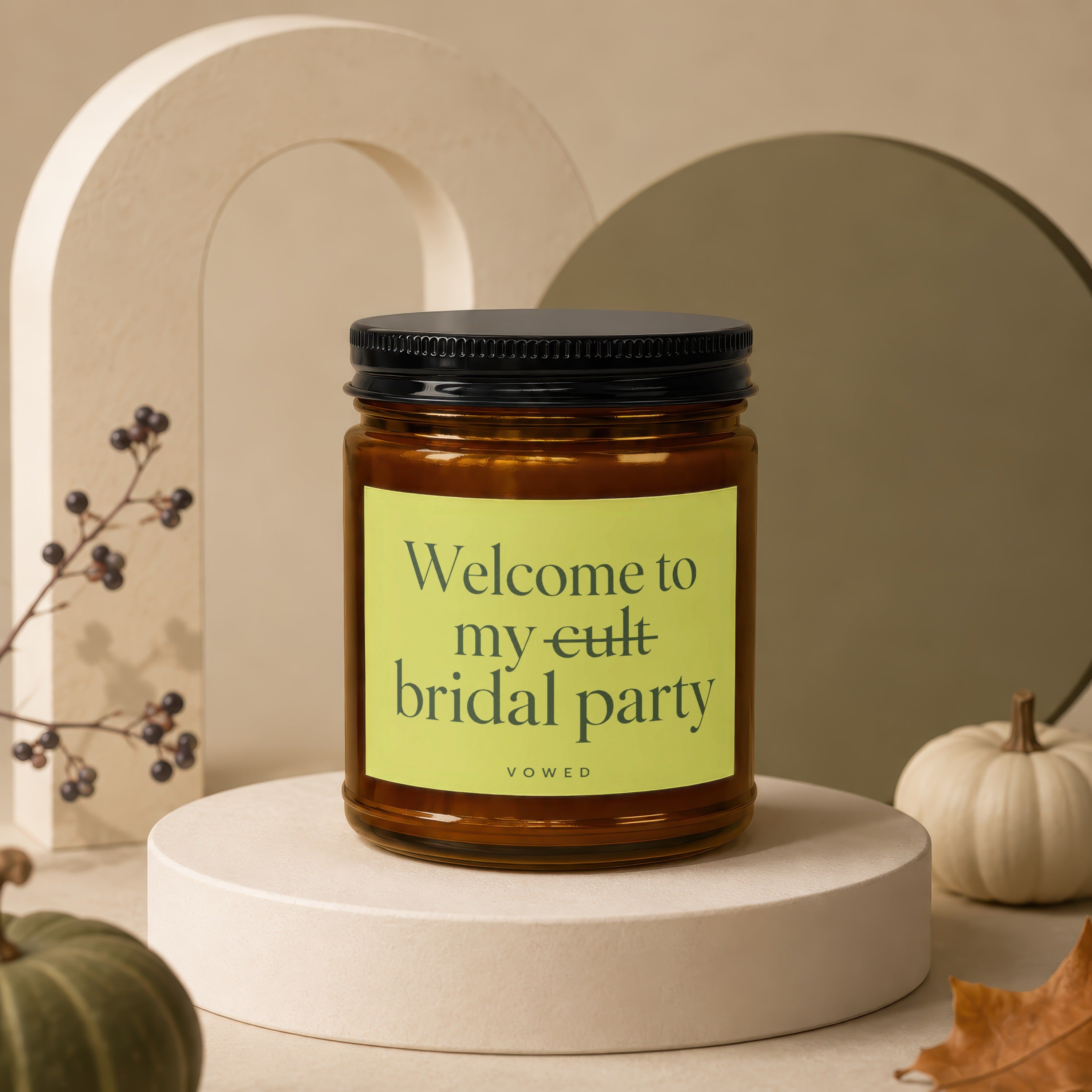 Amber candle with black lid and yellow label reading "Welcome to my bridal party."