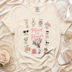 Cream t-shirt with "Maid of Honor" text and wedding-themed icons.