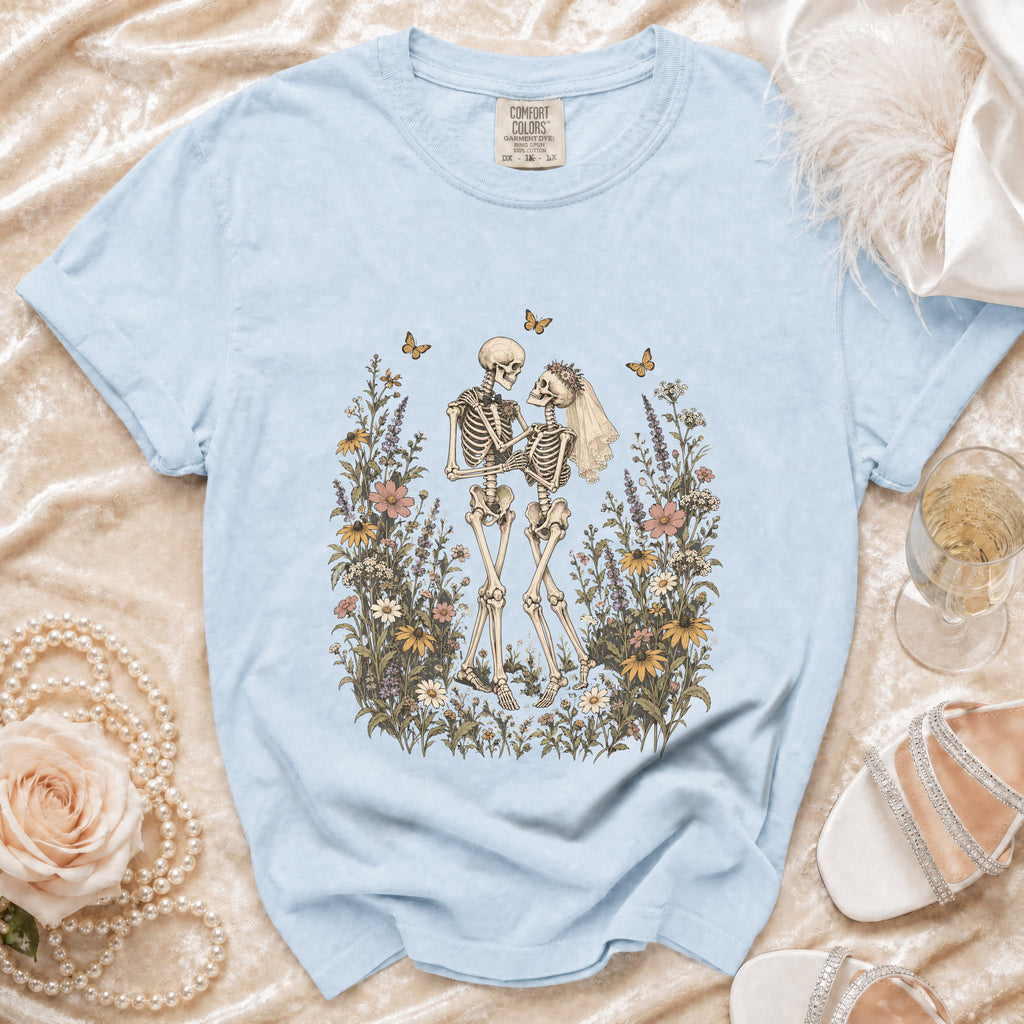 Light blue t-shirt with skeleton couple and floral graphic, Comfort Colors tag.