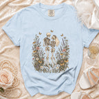 Light blue t-shirt with skeleton couple and floral graphic, Comfort Colors tag.