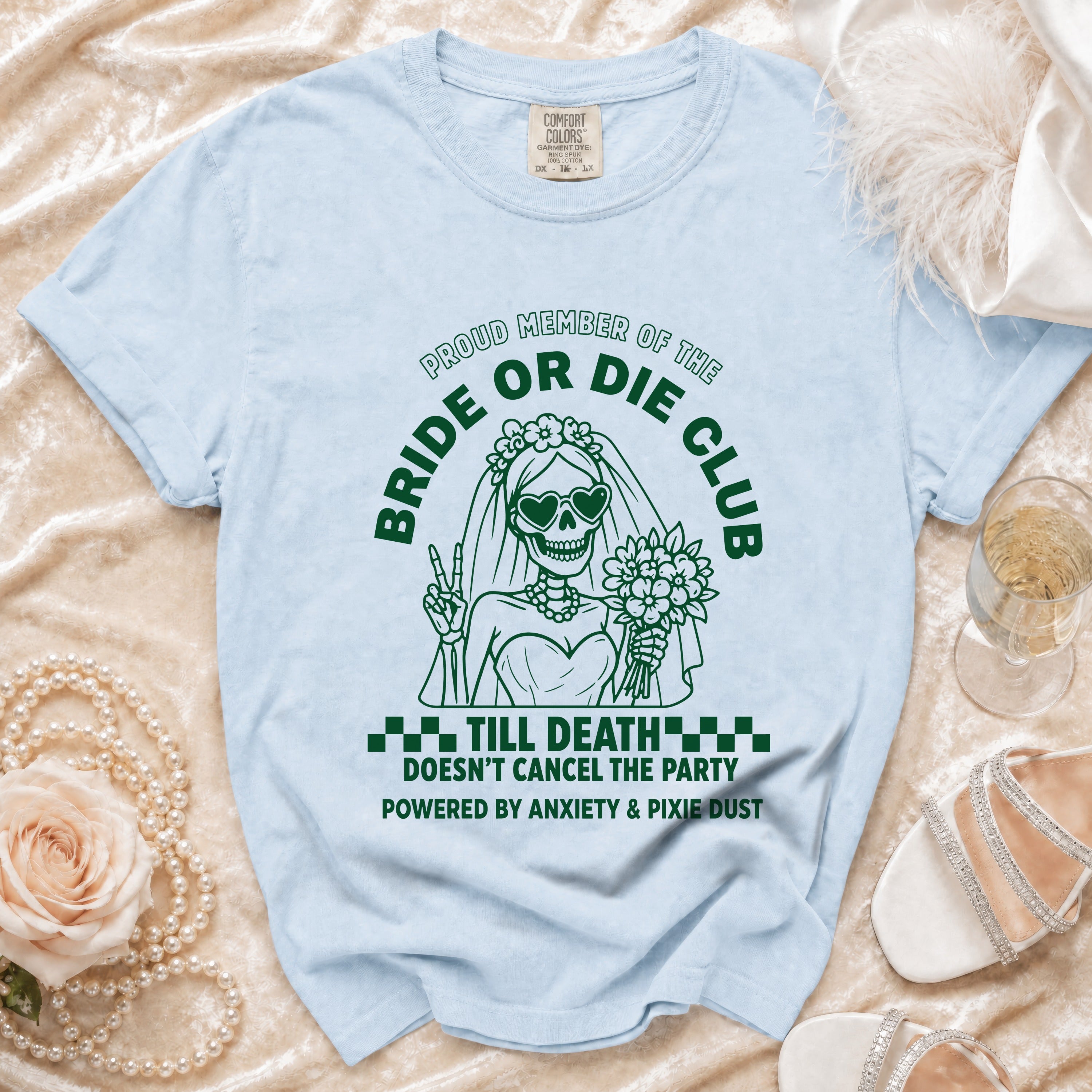 Light blue t-shirt with green skeleton bride graphic and text.