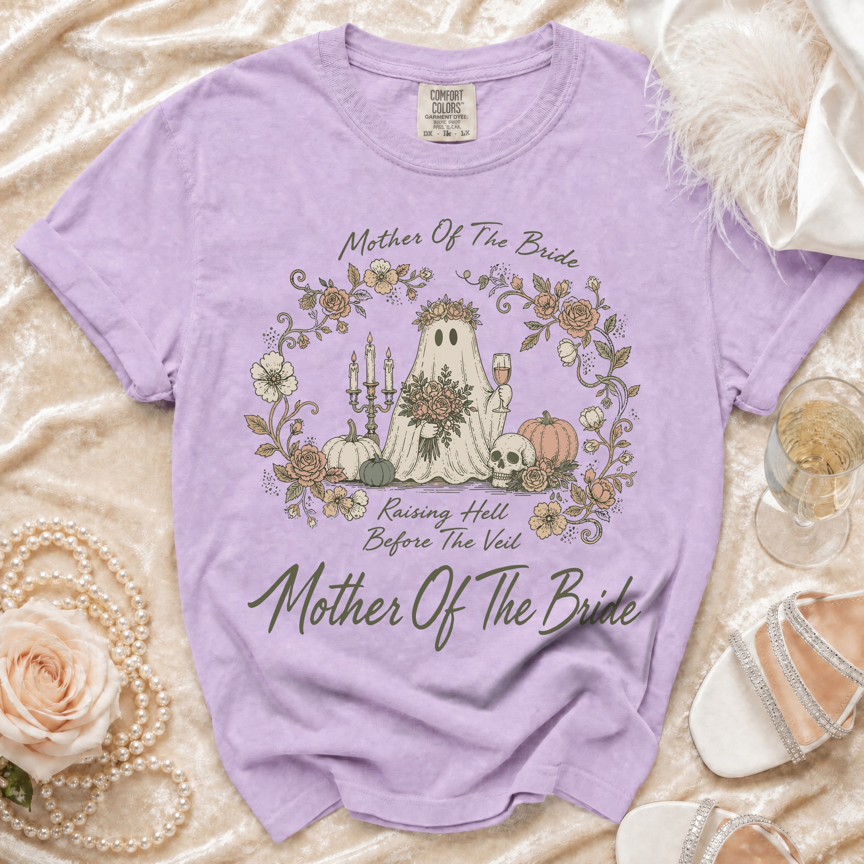 Lavender t-shirt with ghost, skull, and floral graphic reading "Mother Of The Bride".