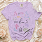 Lavender t-shirt with line drawings of wedding items and "The Bride" text.