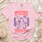 Pink t-shirt with "MOTHER OF THE BRIDE RAISING HELL BEFORE THE VOWS" graphic.