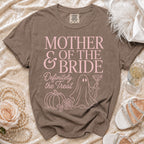 Brown t-shirt with pink text "Mother of the Bride Definitely the Treat" and graphics.