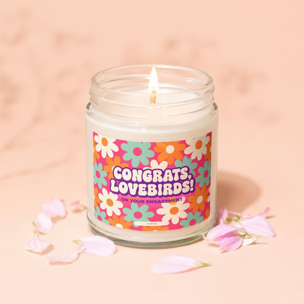 Glass candle with floral label reading "Congrats, Lovebirds! On Your Engagement".