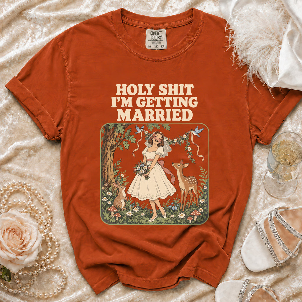 Orange t-shirt with text "HOLY SHIT I'M GETTING MARRIED" and bridal illustration.
