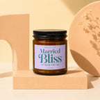 Amber jar candle labeled "Smells Like Married Bliss and Slightly Better Sleep" by Vowed.