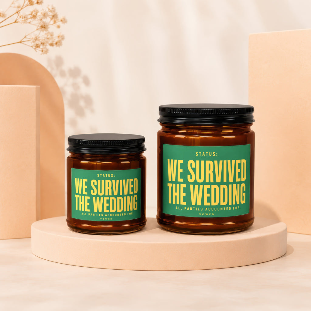 Two amber glass jars with black lids, labeled "We Survived The Wedding".