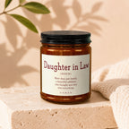 Amber jar candle with text "Daughter in Law" definition.