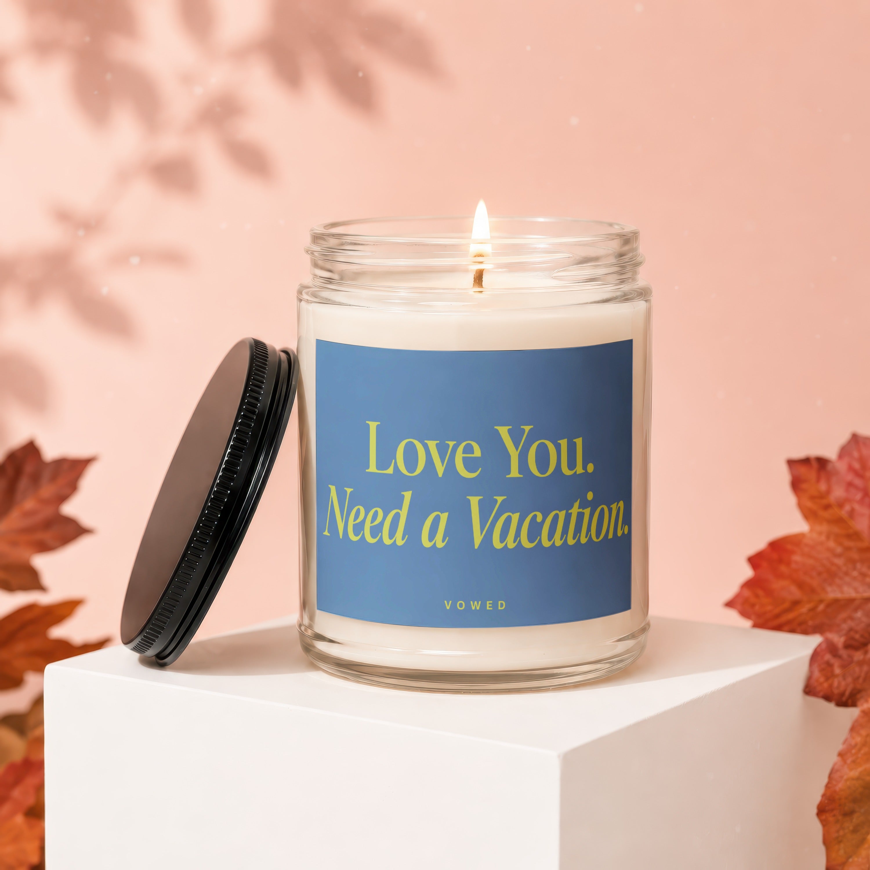 Candle with blue label reading "Love You. Need a Vacation." Vowed.