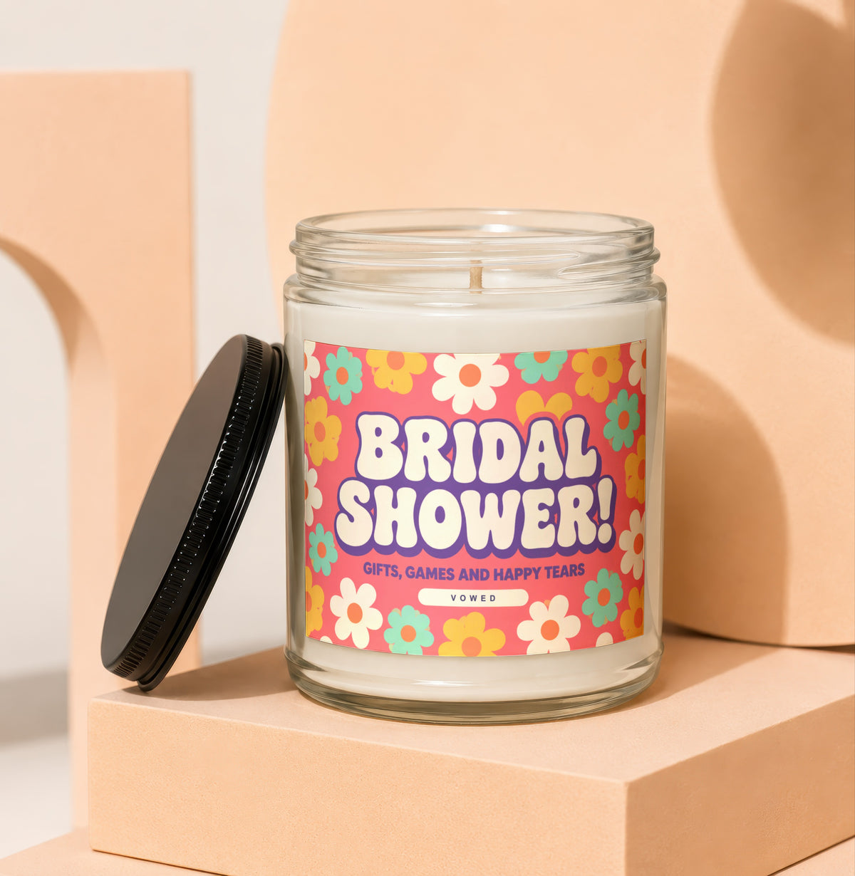 Candle with "BRIDAL SHOWER! GIFTS, GAMES AND HAPPY TEARS VOWED" text on a retro floral label.