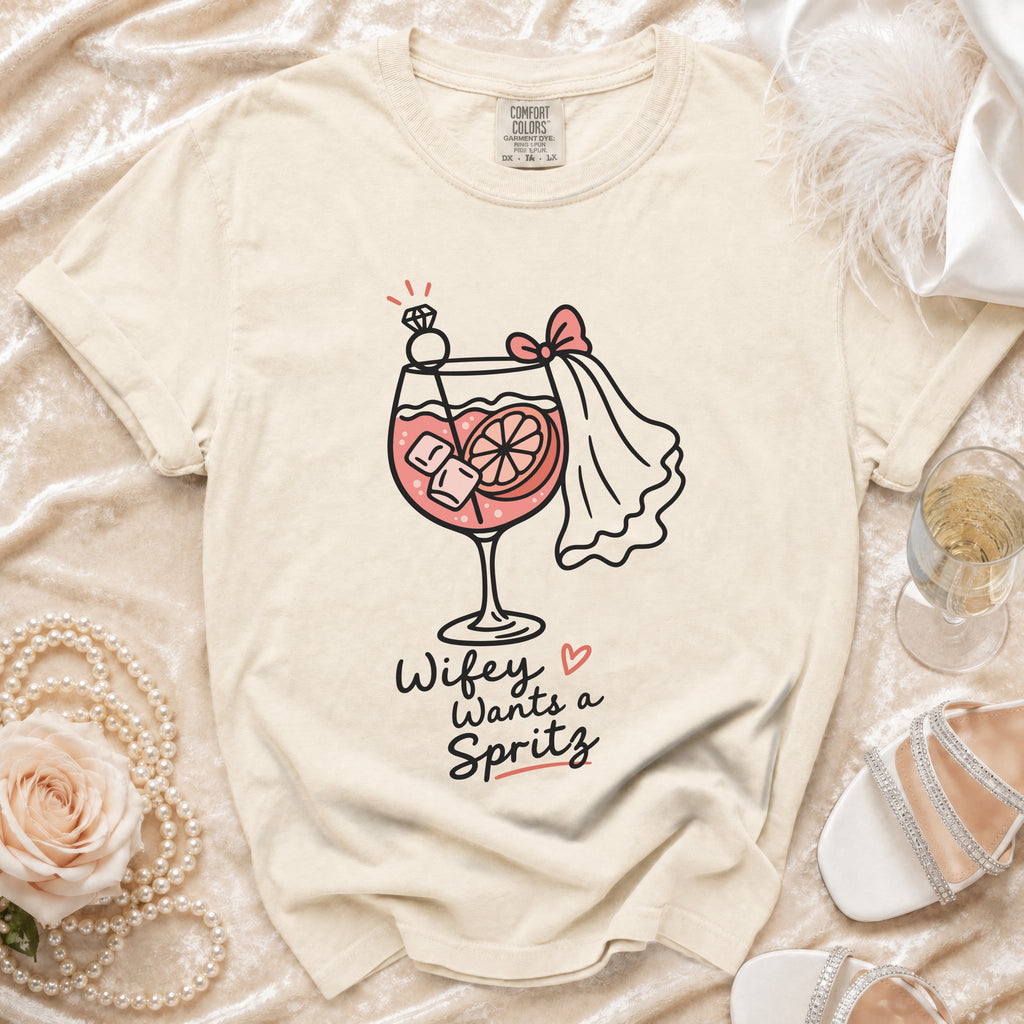 Cream t-shirt with "Wifey Wants a Spritz" graphic and wedding accents.