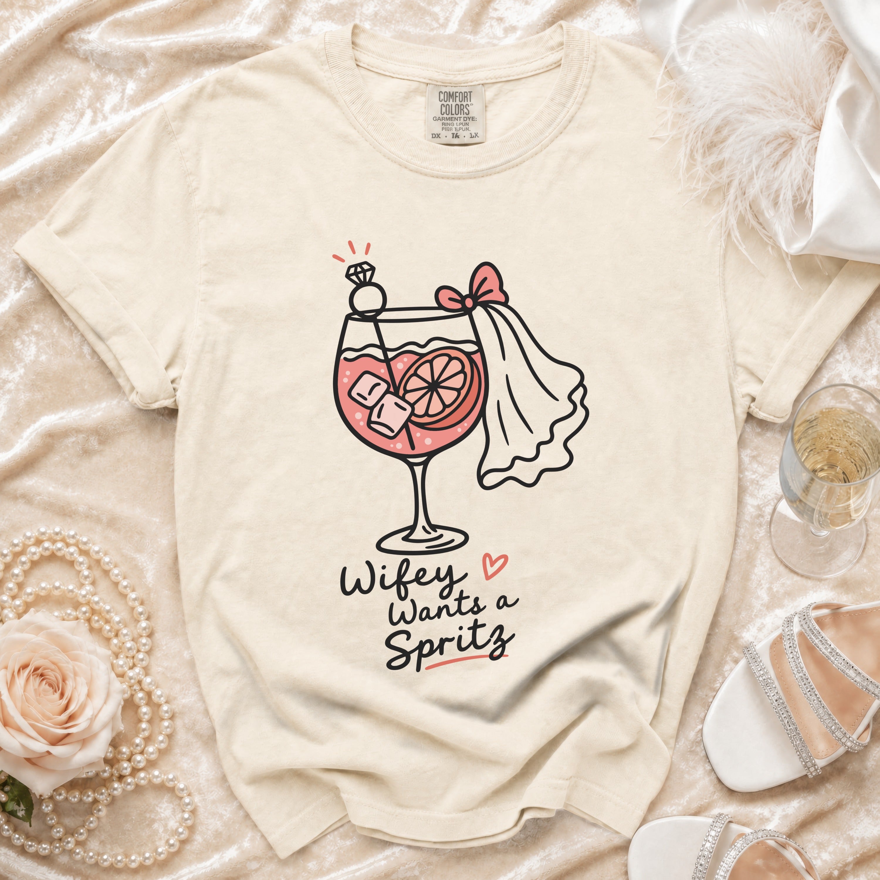 Cream t-shirt with "Wifey Wants a Spritz" graphic and wedding accents.