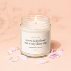 Candle with label "Smells like a very lucky fiancé and a very shiny ring. Congratulations, you two. Vowed."
