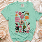 Mint green t-shirt with a collage of vintage-style graphics for a bride and Halloween.