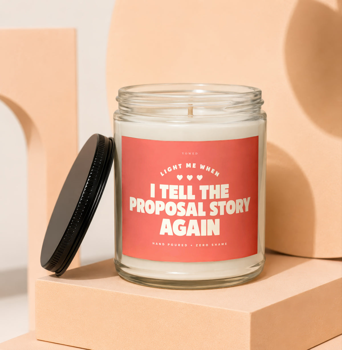 Candle with label "Light me when I tell the proposal story again".