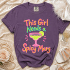 Purple t-shirt with multicolor graphic saying "This Girl Needs a Spicy Marg".