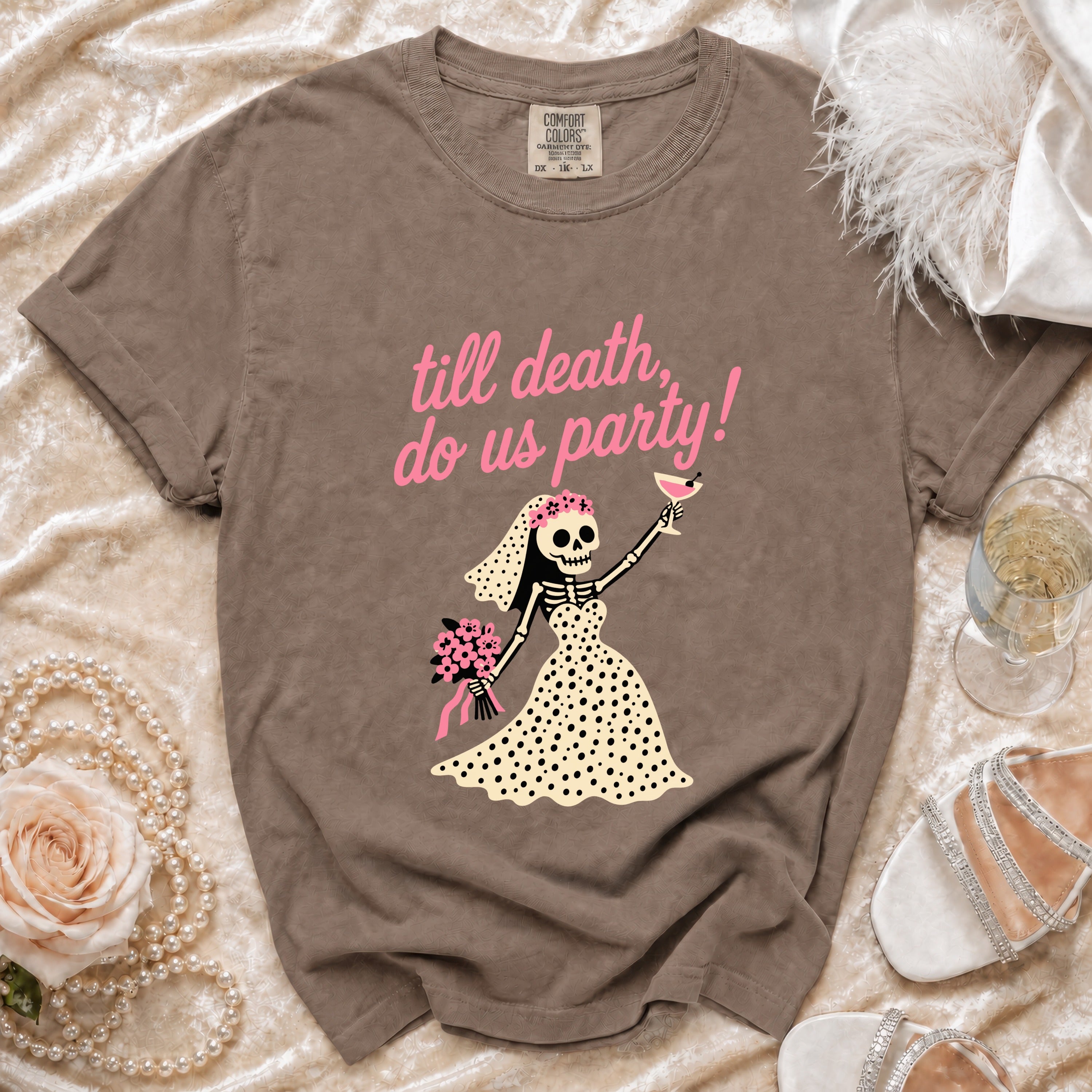 T-shirt with pink text "till death, do us party!" and skeleton bride graphic.