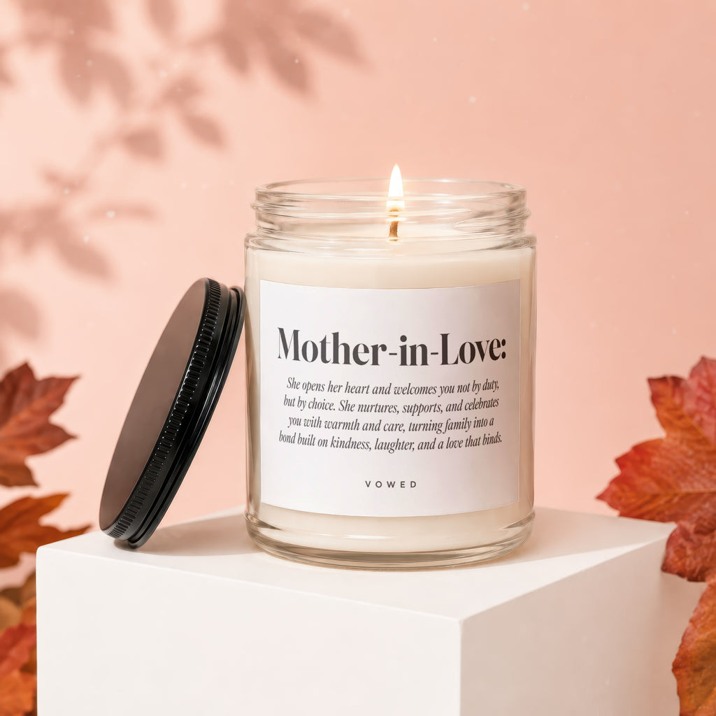 Candle labeled "Mother-in-Love: with descriptive text and VOWED. Lid is ajar."