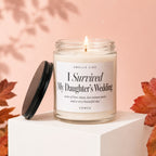 Candle reading "I Survived My Daughter's Wedding" with lid off.