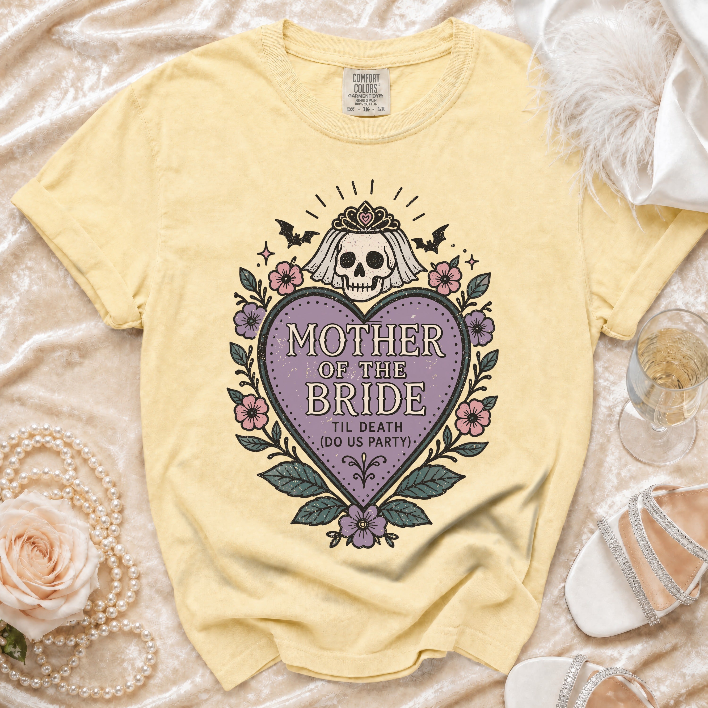 Yellow t-shirt with "Mother of the Bride" skull graphic, bats, and flowers.
