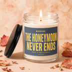 Candle with lit wick and label "WARNING: THE HONEYMOON NEVER ENDS THIS IS NOT A DRILL"