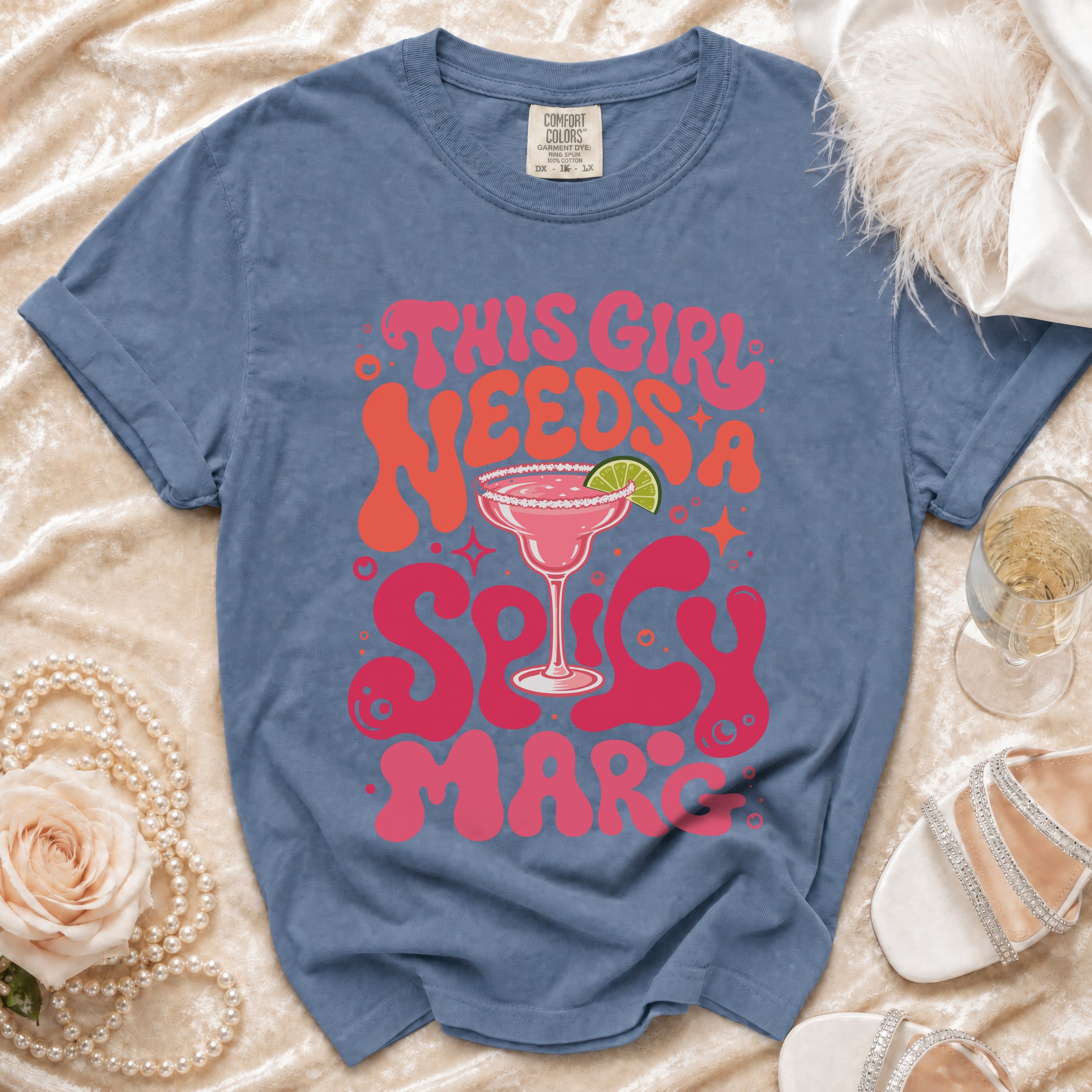 Blue Comfort Colors t-shirt with "This Girl Needs a Spicy Mar" graphic and margarita.