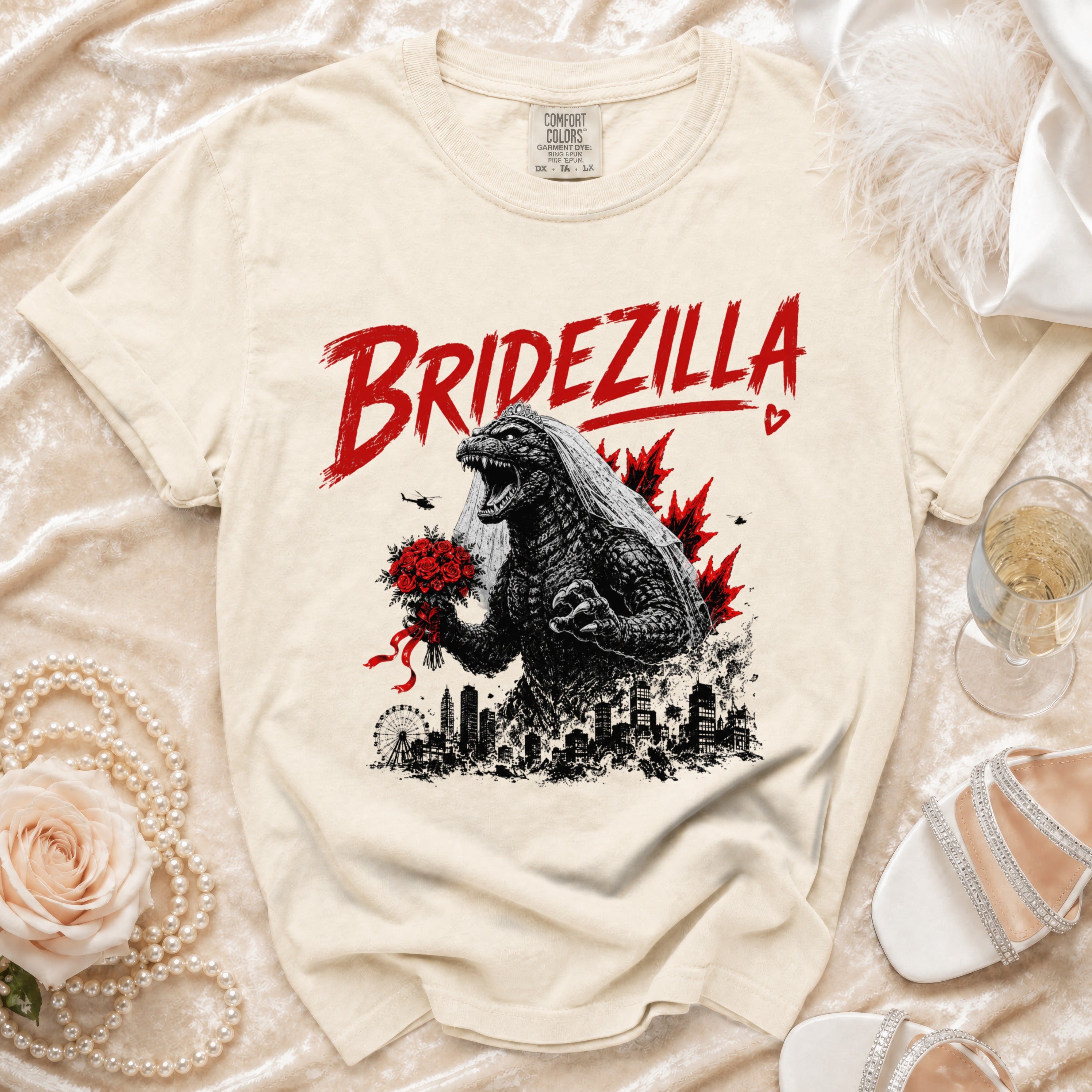 Cream Comfort Colors t-shirt with "BRIDEZILLA" text and Godzilla in a veil holding flowers.