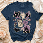 Navy t-shirt with Halloween-themed bridal party graphics including cats, ghost, and haunted house.