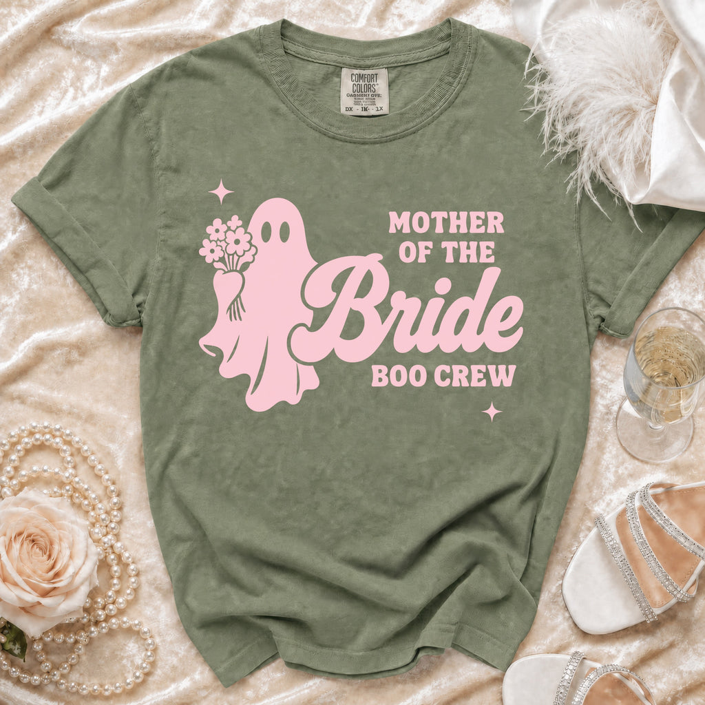 Olive green t-shirt with pink ghost graphic and "Mother of the Bride Boo Crew" text.