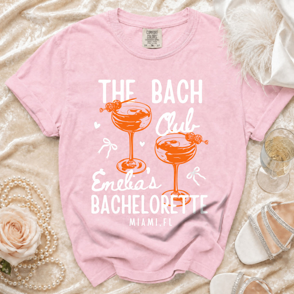 Pink t-shirt with "The Bach Club Enelia's Bachelorette Miami, FL" text.