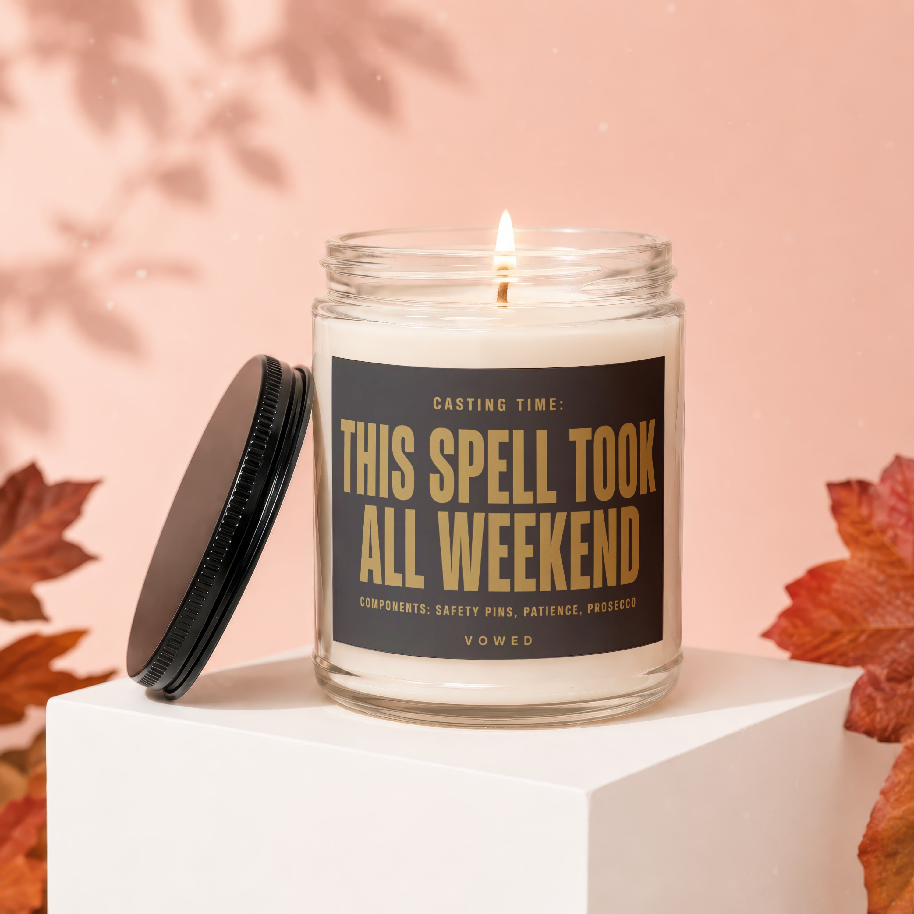 Glass jar candle with label that reads "THIS SPELL TOOK ALL WEEKEND."