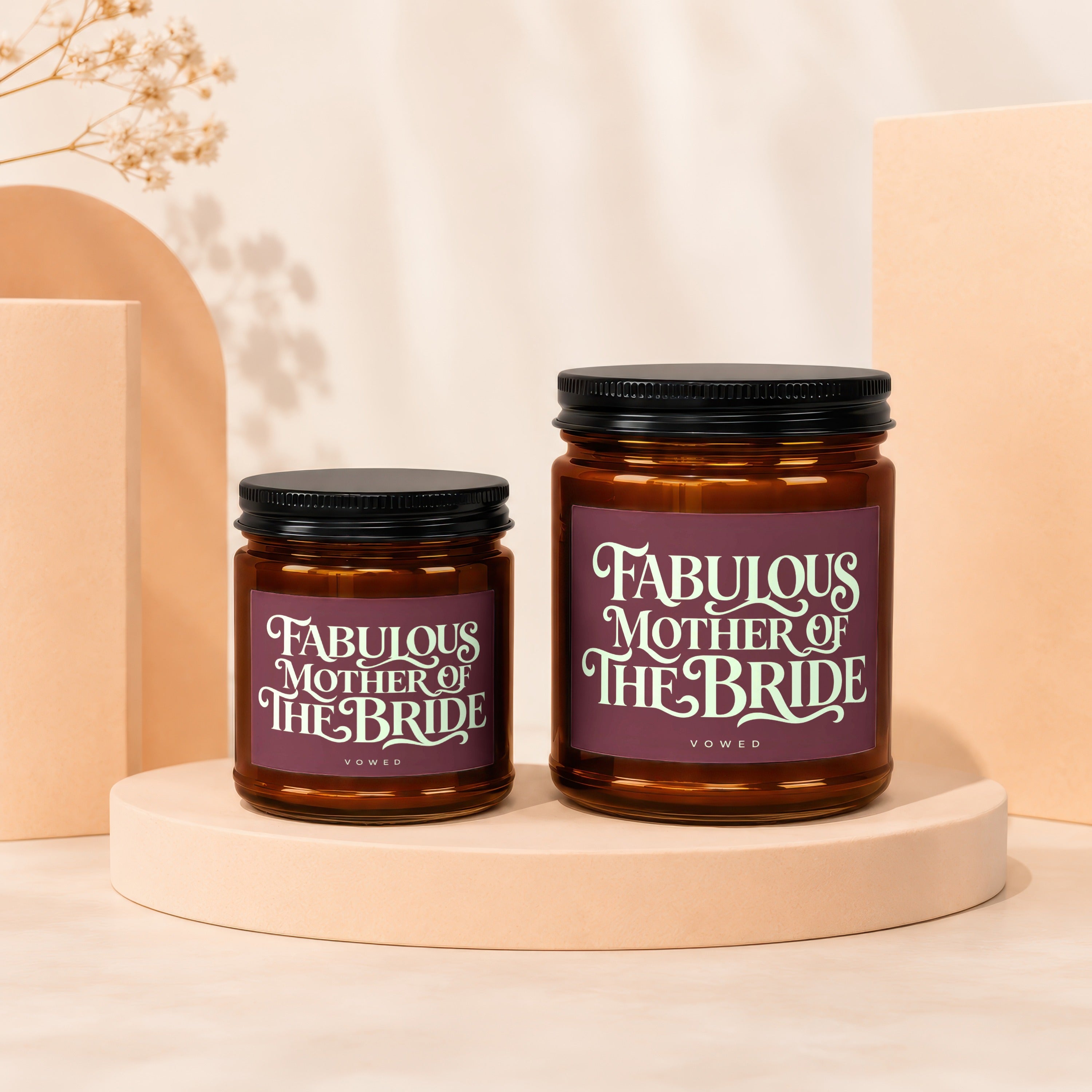 Two amber glass candles with "Fabulous Mother of the Bride" labels.