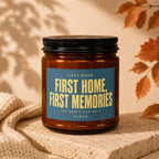Amber candle with "First Home, First Memories" text on blue label.