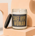 Glass jar candle with black lid, text "Chief Hype Woman" on label.